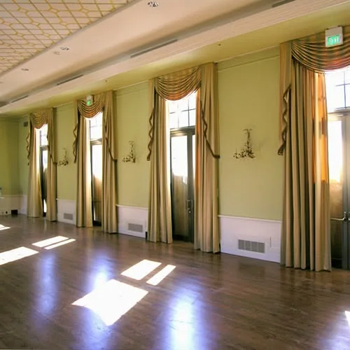Formal room with custom swags and drapery installed along tall windows
